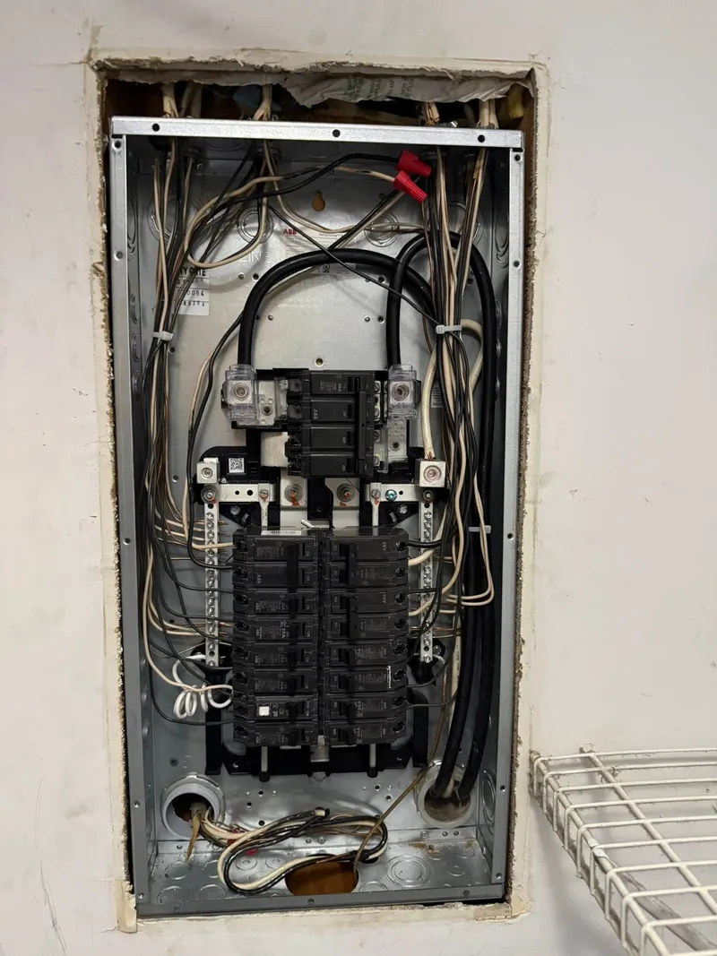 New electrical panel with breakers and neatly routed wiring