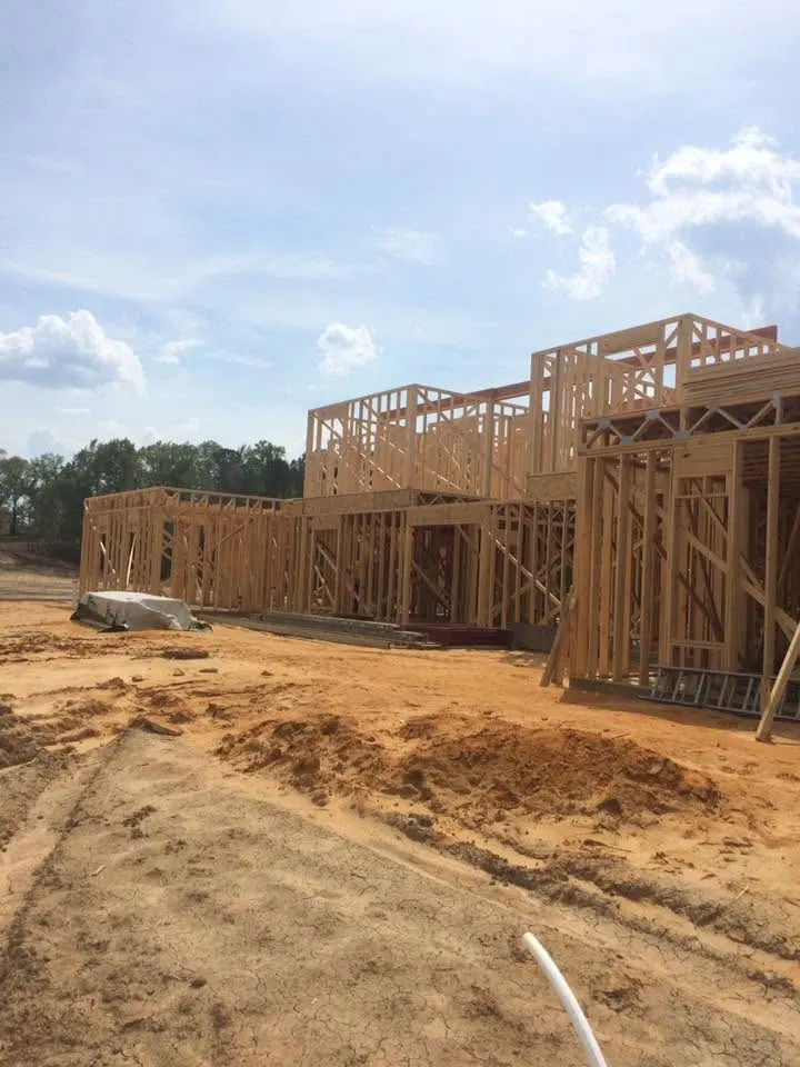 Two-story wood framing for a new house on a cleared lot