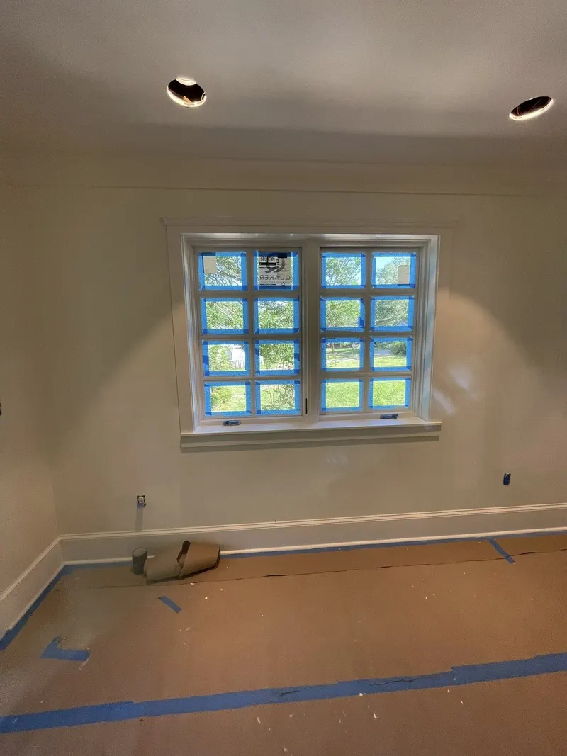 Room with glass block window, crown molding and recessed lights