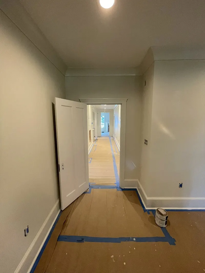 Hallway with painted doors, trim and recessed lights